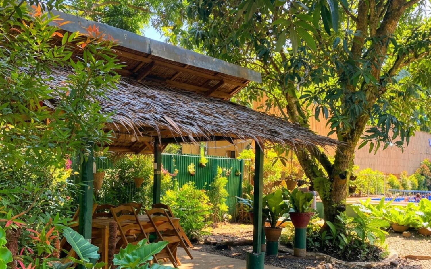 Open garden gazebo shaded by trees